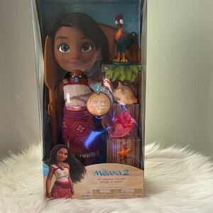 Disney Moana 2 Singing Friend Doll with Brown Hair, Red Outfit, Green Parrot